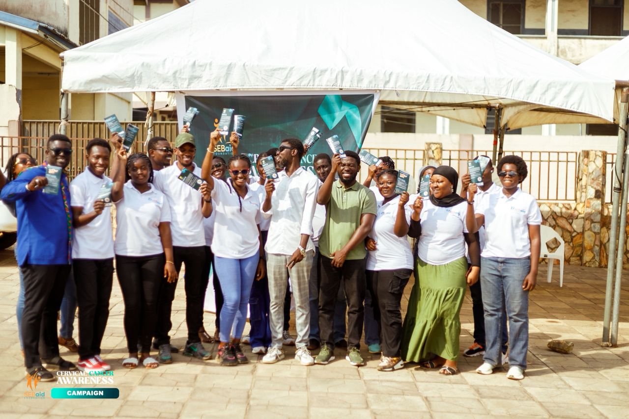 SebAid Foundation volunteers holding awareness brochures
